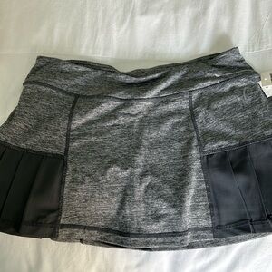 Head tennis skirt. New with tags  size small gray with shorts built in.